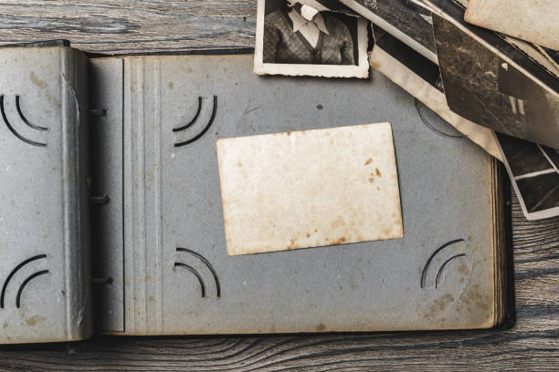 istock retro some old photos on wooden table 1147810118