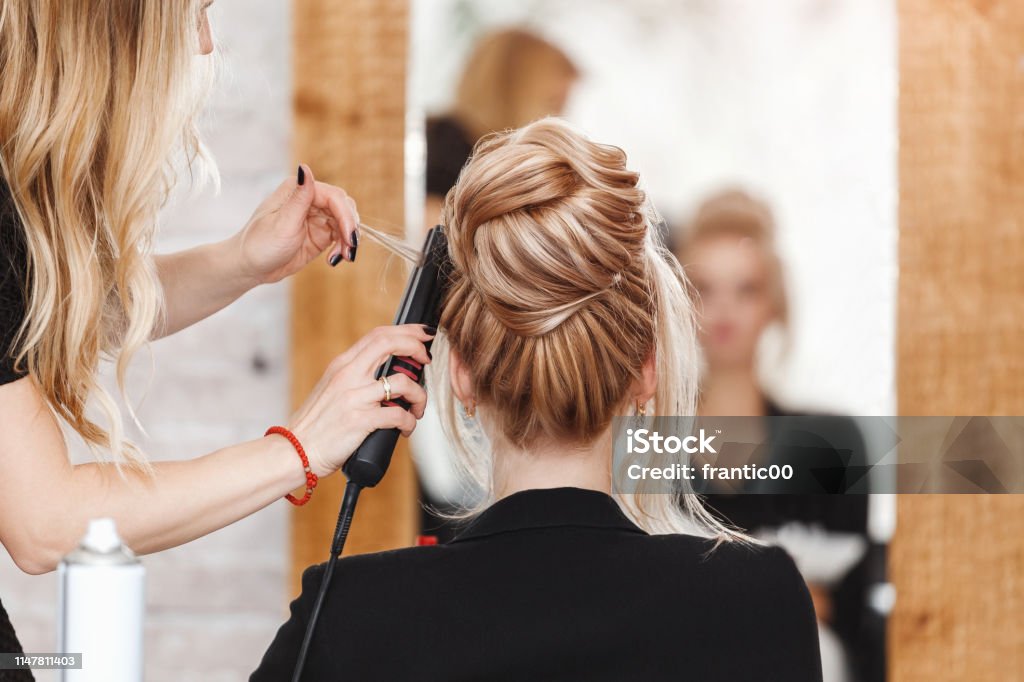 Business Woman Lady Boss In Beauty Salon Making Hairdress And Looking To  The Mirror Stock Photo - Download Image Now - iStock