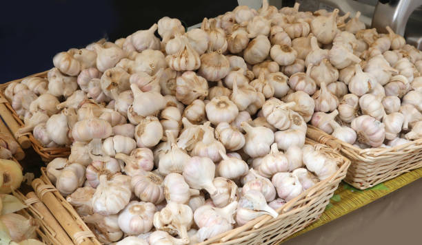 istock garlic for sale at market 1147814800