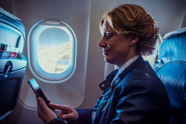 istock Business woman at airplane 1147816673