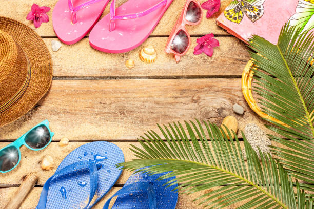 istock Beach, palm tree leaves, sand, sunglasses and flip flops 1147817763