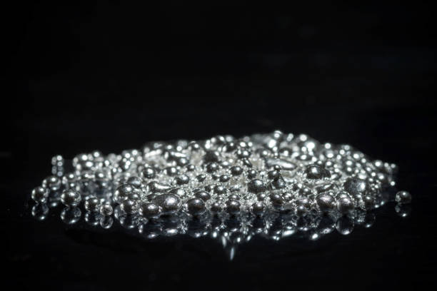 Water pearls on wet stone surface.