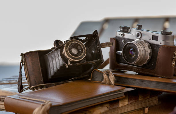 istock Old camera and photo album 1147818013