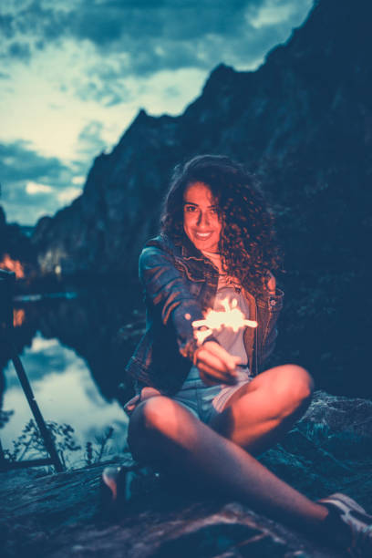istock Cute Female Offering A Flaming Sparkler 1147820415