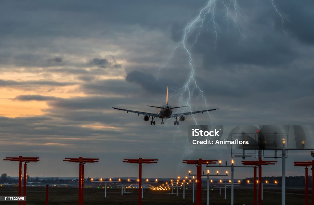 Thunderstorm on landing airplane at the airport Airplane Stock Photo