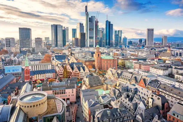 Stock photograph of the skyline of downtown Frankfurt am Main Germany with the old town in the foreground on a sunny day.