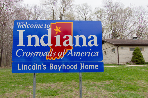 Michigan City, Indiana, USA - April 25, 2019: Indiana welcome sign at a rest area along Interstate 94 outside of Michigan City, Indiana.