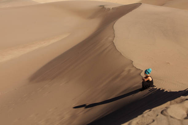 istock Beautiful woman in desert 1147823770