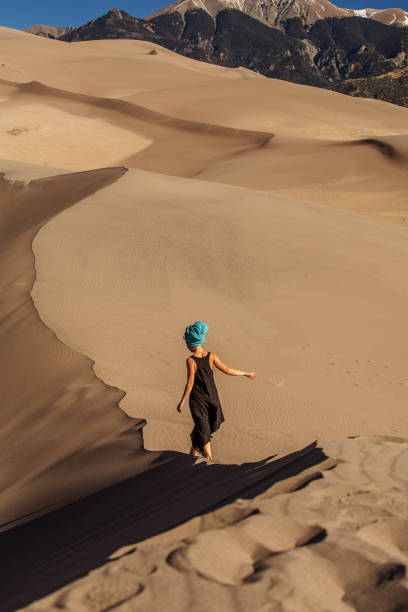istock Beautiful woman in desert 1147823776