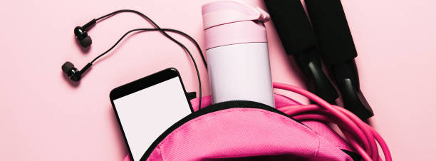 istock Sports bag and accessories on pink background 1147829257