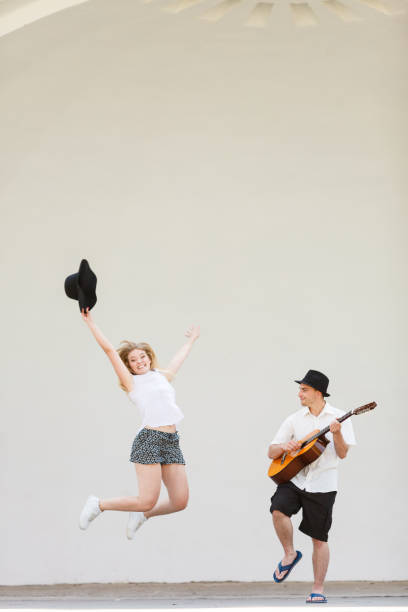 istock Man playing guitar, woman having fun 1147830782