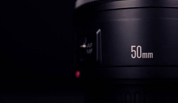 istock 50mm lens on black background 1147833189