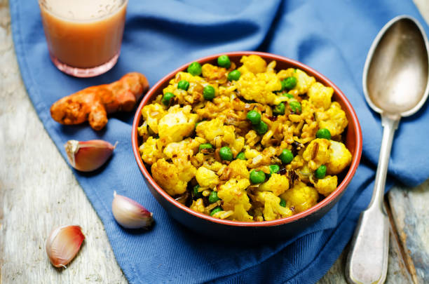 istock cauliflower green peas turmeric rice on a wood background 1147836042