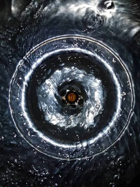 Water flowing down a drain