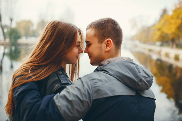 istock Couple in autumn park 1147841120