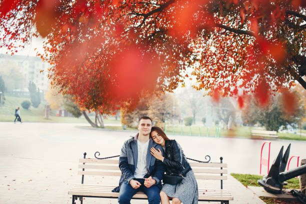 istock Couple in autumn park 1147841710