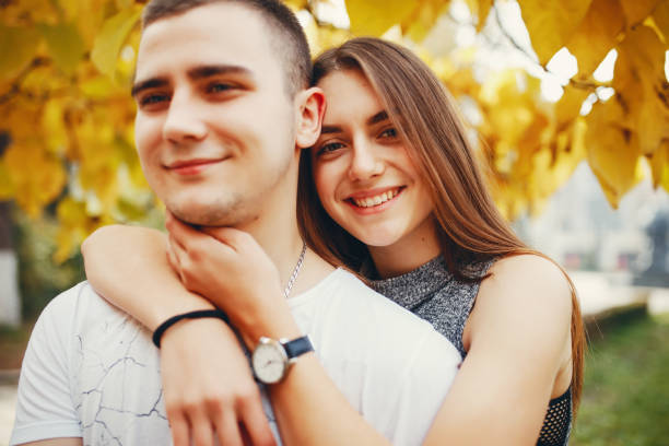 istock Couple in autumn park 1147843024