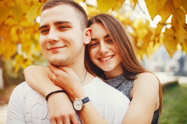 istock Couple in autumn park 1147843068