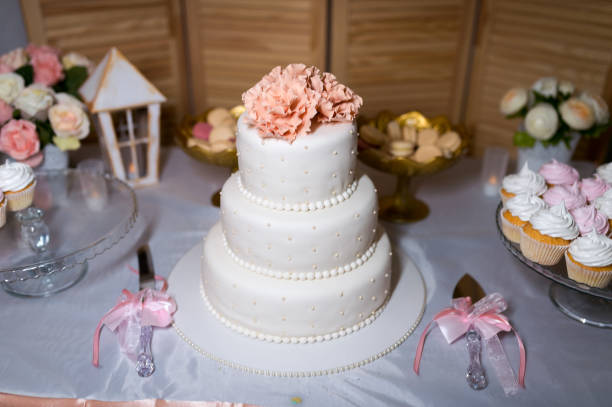 istock White wedding cake with flowers. Wedding decoration. 1147843864