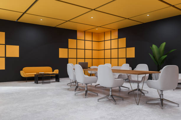 istock Black and yellow meeting room corner 1147845954