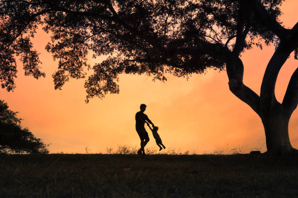 istock Father playing with his little son in the park 1147847050