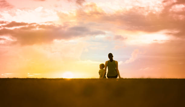 istock Mother and son watching beautiful sunset 1147847180