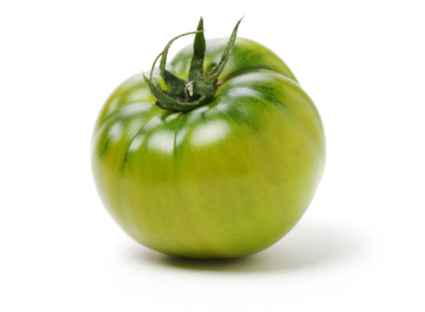 istock fresh green tomato isolated on white background 1147853903