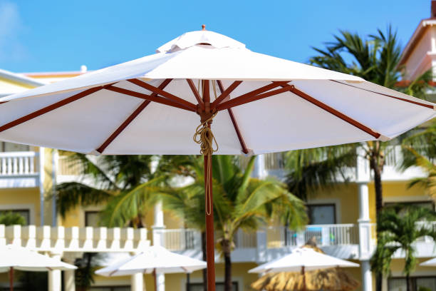 istock Large white sunshades at the swimming pool 1147857140