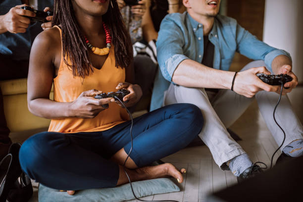 istock Colleagues playing video games in the office relax room 1147862223