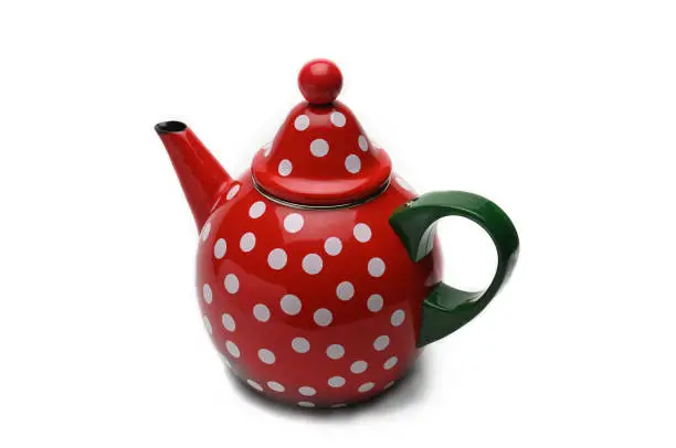 Photo of Red kettle for brewing tea.Teapot.Isolated on white background