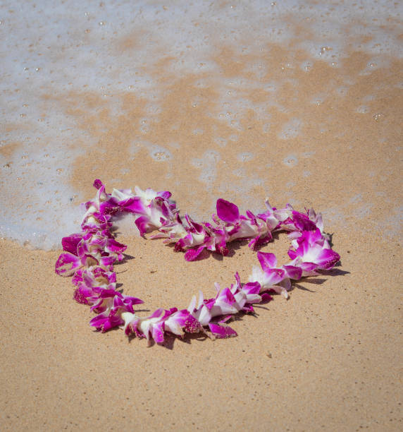 istock Orchid Lei on a beach in Maui 1147870572