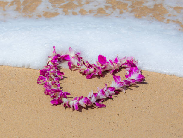 istock Orchid Lei on a beach in Maui 1147870603