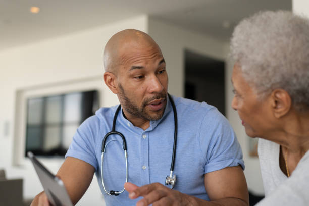 istock Doctor showing his patient their results 1147874714