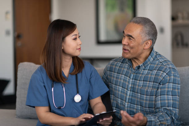 istock Young doctor with elderly patient 1147874718