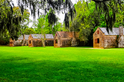The original slave cabins located on Boone Hall Plantation in Charleston, South Carolina were built between 1790 and 1810. Each family lived in this type of housing. The slaves made their bricks for the housing by hand. Heat came from the small fire place in the house. There was no cooling in the hot and humid days.