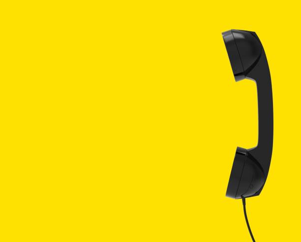 istock Telephone Handset, Black Color on Yellow Background, 3D Rendering 1147876408