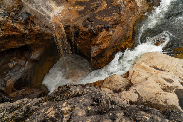istock Beautiful view of a waterfall flowing between fantastic sculptural rocks. 1147876620