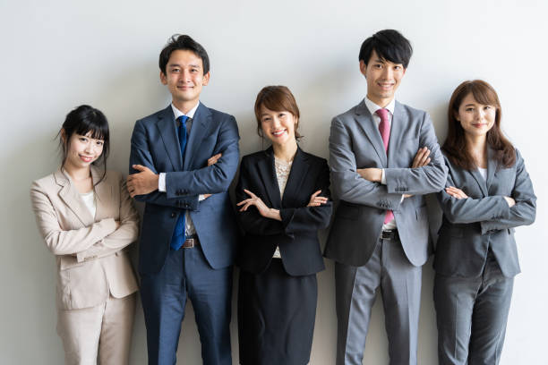 アジアビジネスグループのポートレートスタンディング - ビジネスマン 日本人 ストックフォトと画像