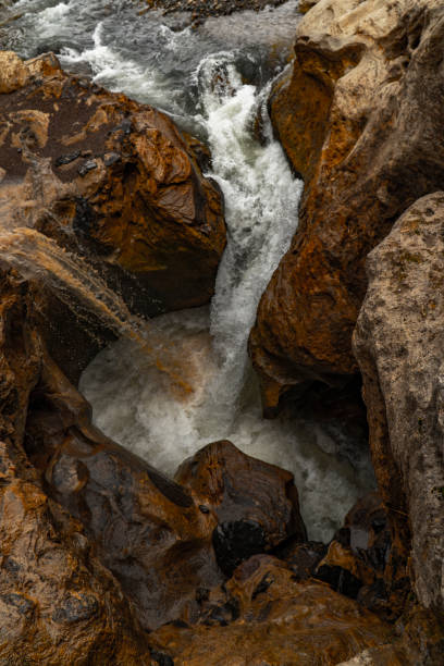 istock Beautiful view of a waterfall flowing between fantastic sculptural rocks. 1147878233