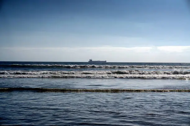 A containership offshore, looking from Rosarito Beach on the Baja Peninsula, Pacific Ocean
