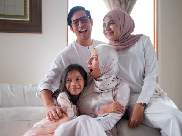 istock Small family laughing and talking 1147885130