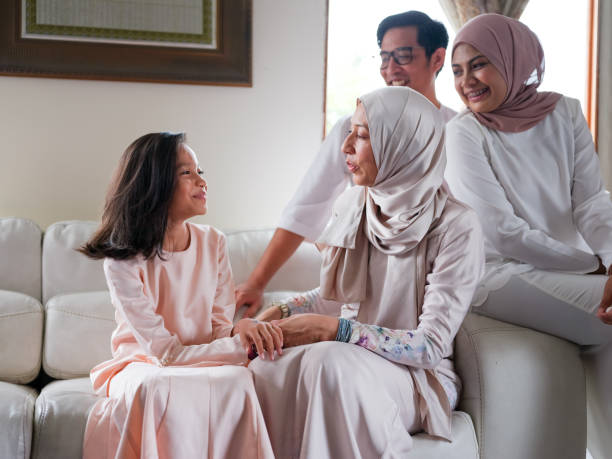 istock Small family laughing and talking 1147885136