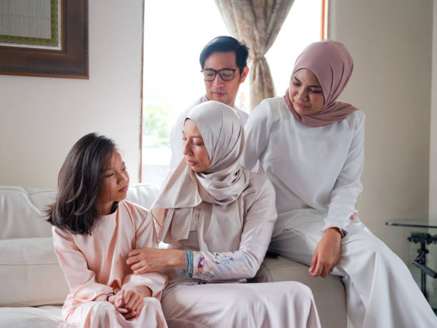 istock Small family laughing and talking 1147885239
