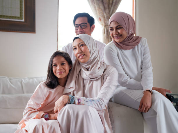 istock Small family laughing and talking 1147885756