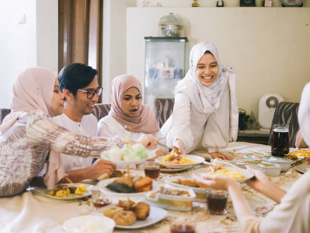 istock Family gathering and eating together 1147888274