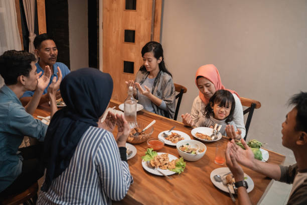 istock muslim family pray before dinner 1147891226