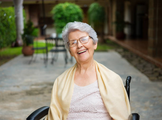Lovely Elderly Woman On Wheelchair Smiling At Camera Stock Photo - Download  Image Now - iStock