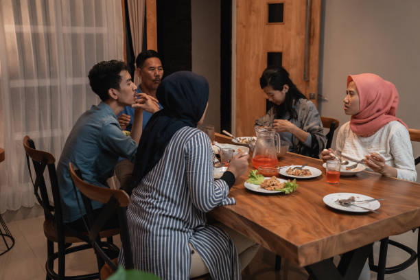 istock asian muslim family dinner together. break fasting 1147892485