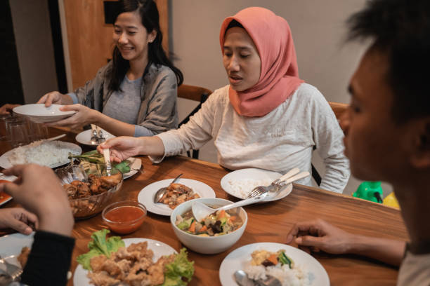istock asian muslim family dinner together. break fasting 1147892707