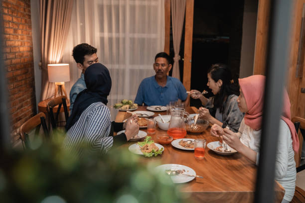 istock asian muslim family dinner together. break fasting 1147892806